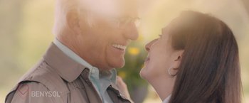 Movie still from “Zoe” (2018), directed by Drake Doremus – An older man and a younger woman smiling at each other; Close Up shot, Over the shoulder angle
