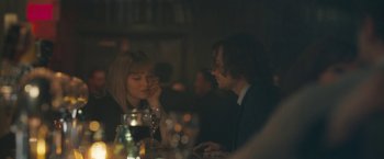 Movie still from “Zoe” (2018), directed by Drake Doremus – A man and a woman sitting at a dinner table; Medium shot, Over the shoulder angle