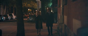 Movie still from “Zoe” (2018), directed by Drake Doremus – A man and a woman holding hands on a sidewalk; Medium shot, Over the shoulder angle