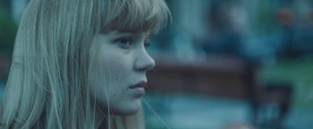 Movie still from “Zoe” (2018), directed by Drake Doremus – A young woman with blonde hair looking to her left; Close Up shot, Low angle
