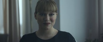 Movie still from “Zoe” (2018), directed by Drake Doremus – A person wearing a black shirt; Close Up shot, Over the shoulder angle