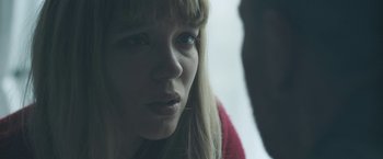 Movie still from “Zoe” (2018), directed by Drake Doremus – A person looking at the camera; Close Up shot, Over the shoulder angle