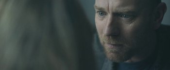 Movie still from “Zoe” (2018), directed by Drake Doremus – A man's face in a mirror; Close Up shot, Over the shoulder angle