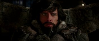 Movie still from “Zoolander 2” (2016), directed by Ben Stiller – A person wearing a fur coat; Close Up shot, Over the shoulder angle