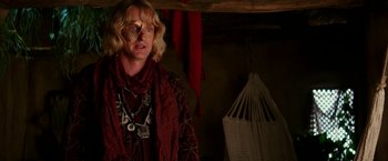 Movie still from “Zoolander 2” (2016), directed by Ben Stiller – A person wearing a scarf and a necklace; Close Up shot, Over the shoulder angle