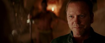 Movie still from “Zoolander 2” (2016), directed by Ben Stiller – A person wearing a black jacket; Close Up shot, Over the shoulder angle