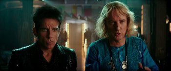 Movie still from “Zoolander 2” (2016), directed by Ben Stiller – A couple of people standing next to each other in a room; Close Up shot, Low angle
