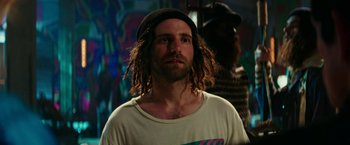 Movie still from “Zoolander 2” (2016), directed by Ben Stiller – A man with dreads is looking at the camera; Medium shot, Low angle