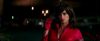 Movie still from “Zoolander 2” (2016), directed by Ben Stiller – A woman in a red jacket holding a cell phone; Close Up shot, Low angle