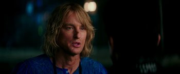 Movie still from “Zoolander 2” (2016), directed by Ben Stiller – A person with long blonde hair; Close Up shot, Over the shoulder angle