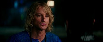 Movie still from “Zoolander 2” (2016), directed by Ben Stiller – A person with long blonde hair; Close Up shot, Over the shoulder angle