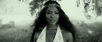 Movie still from “Zoolander 2” (2016), directed by Ben Stiller – A black and white photo of a woman with long black hair; Close Up shot, Low angle