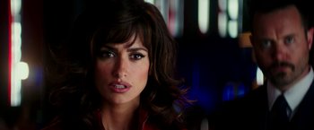 Movie still from “Zoolander 2” (2016), directed by Ben Stiller – A woman's face in a dark room; Close Up shot, Over the shoulder angle