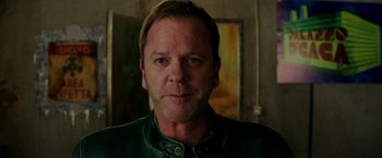 Movie still from “Zoolander 2” (2016), directed by Ben Stiller – A person wearing a leather jacket; Close Up shot, Over the shoulder angle