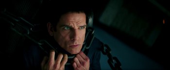 Movie still from “Zoolander 2” (2016), directed by Ben Stiller – A person holding a cell phone; Close Up shot, Low angle