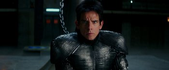 Movie still from “Zoolander 2” (2016), directed by Ben Stiller – A person wearing a metal suit; Close Up shot, Over the shoulder angle