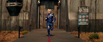 Movie still from “Zoolander 2” (2016), directed by Ben Stiller – A man in a costume running down a street; Wide shot, Low angle