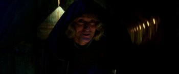 Movie still from “Zoolander 2” (2016), directed by Ben Stiller – A woman with blonde curly hair wearing a blue robe; Close Up shot, Low angle