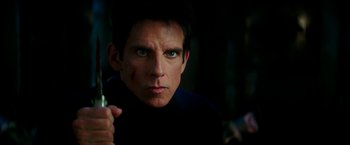 Movie still from “Zoolander 2” (2016), directed by Ben Stiller – A person holding a cell phone; Close Up shot, Over the shoulder angle