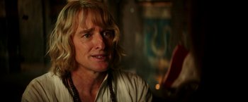 Movie still from “Zoolander 2” (2016), directed by Ben Stiller – A person with long blonde hair; Close Up shot, Over the shoulder angle