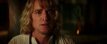 Movie still from “Zoolander 2” (2016), directed by Ben Stiller – A person with long blonde hair; Close Up shot, Over the shoulder angle