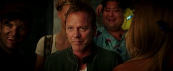 Movie still from “Zoolander 2” (2016), directed by Ben Stiller – A person wearing a green jacket; Close Up shot, Over the shoulder angle