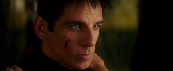 Movie still from “Zoolander 2” (2016), directed by Ben Stiller – A person with a scar on his face; Close Up shot, Over the shoulder angle