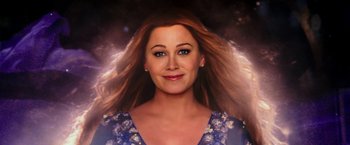 Movie still from “Zoolander 2” (2016), directed by Ben Stiller – A woman with long red hair and a blue floral dress; Close Up shot, Overhead angle