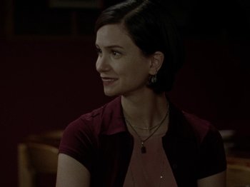 Movie still from “Mid90s” (2018), directed by Jonah Hill – A woman in a red shirt is looking to her left; Close Up shot, Over the shoulder angle