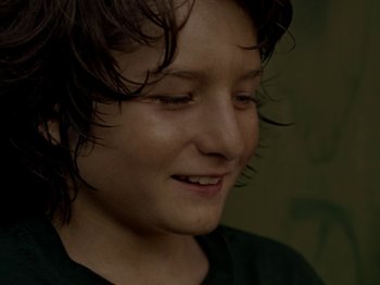 Movie still from “Mid90s” (2018), directed by Jonah Hill – A person with wet hair; Close Up shot, Over the shoulder angle