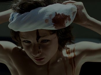 Movie still from “Mid90s” (2018), directed by Jonah Hill – A young man with blood all over his face; Close Up shot, Overhead angle