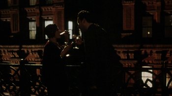 Movie still from “Bullets Over Broadway” (1994), directed by Woody Allen – A man and a woman are having a drink together; Wide shot, Over the shoulder angle