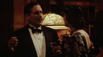 Movie still from “Bullets Over Broadway” (1994), directed by Woody Allen – A man and a woman are talking to each other; Medium shot, Over the shoulder angle