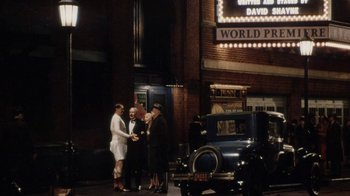 Movie still from “Bullets Over Broadway” (1994), directed by Woody Allen – A group of people standing next to each other on the street; Wide shot, High angle