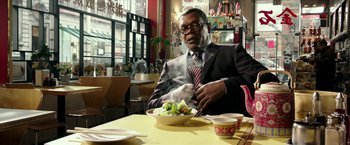Movie still from “xXx: Return of Xander Cage” (2017), directed by D.J. Caruso – A man sitting at a table in front of a bowl of broccoli; Medium shot, Over the shoulder angle