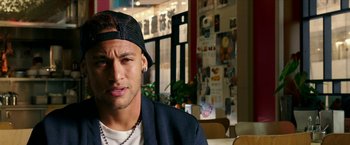 Movie still from “xXx: Return of Xander Cage” (2017), directed by D.J. Caruso – A person wearing a hat; Close Up shot, Over the shoulder angle