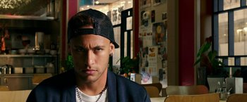 Movie still from “xXx: Return of Xander Cage” (2017), directed by D.J. Caruso – A man wearing a black hat and a jacket; Close Up shot, Over the shoulder angle