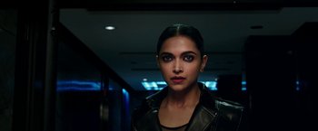 Movie still from “xXx: Return of Xander Cage” (2017), directed by D.J. Caruso – Deepika padukone in a black leather jacket and red lipstick; Close Up shot, Over the shoulder angle