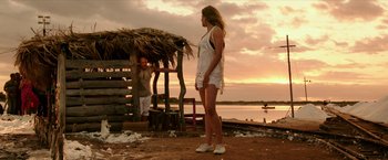 Movie still from “xXx: Return of Xander Cage” (2017), directed by D.J. Caruso – A woman standing in front of a hut on the beach; Wide shot, Low angle