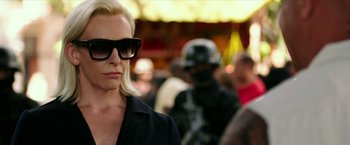 Movie still from “xXx: Return of Xander Cage” (2017), directed by D.J. Caruso – A woman wearing sunglasses and a black jacket; Close Up shot, Over the shoulder angle