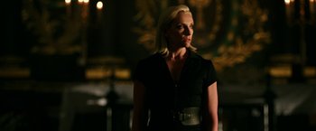 Movie still from “xXx: Return of Xander Cage” (2017), directed by D.J. Caruso – A woman in a black dress is standing in the dark; Medium shot, Low angle