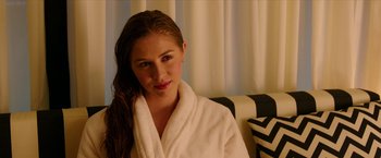 Movie still from “xXx: Return of Xander Cage” (2017), directed by D.J. Caruso – A woman in a white bathrobe sitting on a chair; Close Up shot, Over the shoulder angle