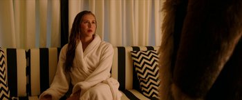 Movie still from “xXx: Return of Xander Cage” (2017), directed by D.J. Caruso – A woman sitting on top of a couch in a room; Medium shot, Over the shoulder angle