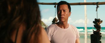 Movie still from “xXx: Return of Xander Cage” (2017), directed by D.J. Caruso – A man and a woman standing next to each other in front of a bamboo structure; Close Up shot, Over the shoulder angle