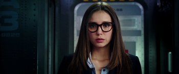 Movie still from “xXx: Return of Xander Cage” (2017), directed by D.J. Caruso – A woman wearing glasses and a suit; Close Up shot, Over the shoulder angle