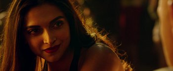 Movie still from “xXx: Return of Xander Cage” (2017), directed by D.J. Caruso – A woman's face in the dark; Close Up shot, Over the shoulder angle