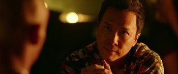 Movie still from “xXx: Return of Xander Cage” (2017), directed by D.J. Caruso – A person wearing a floral shirt; Close Up shot, Over the shoulder angle