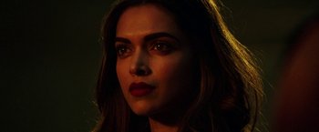 Movie still from “xXx: Return of Xander Cage” (2017), directed by D.J. Caruso – A woman's face in the dark; Close Up shot, Over the shoulder angle