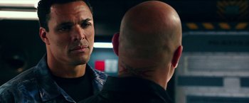 Movie still from “xXx: Return of Xander Cage” (2017), directed by D.J. Caruso – Two men are talking to each other in a dark room; Close Up shot, Over the shoulder angle