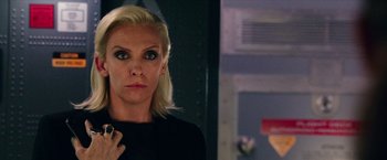 Movie still from “xXx: Return of Xander Cage” (2017), directed by D.J. Caruso – A woman in a black shirt is looking at the camera; Close Up shot, Over the shoulder angle